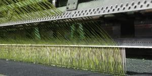 Grès artificiel de football Dtex de qualité supérieure 11000 avec résistance aux UV et trous de drainage perforés
